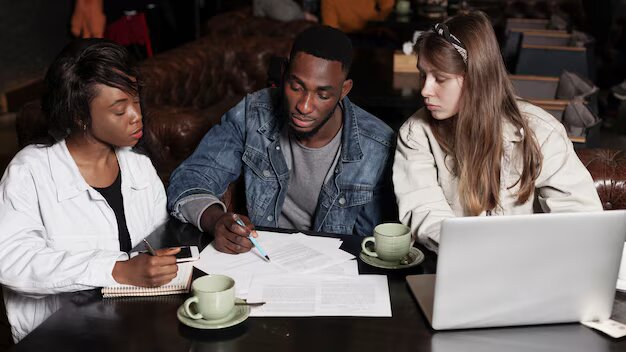 multiracial-friends-working-indoors_23-2148422363.jpg
