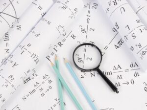 rolls-paper-drawings-with-math-electrical-formulas-magnifier-pencils_113913-1351.jpg